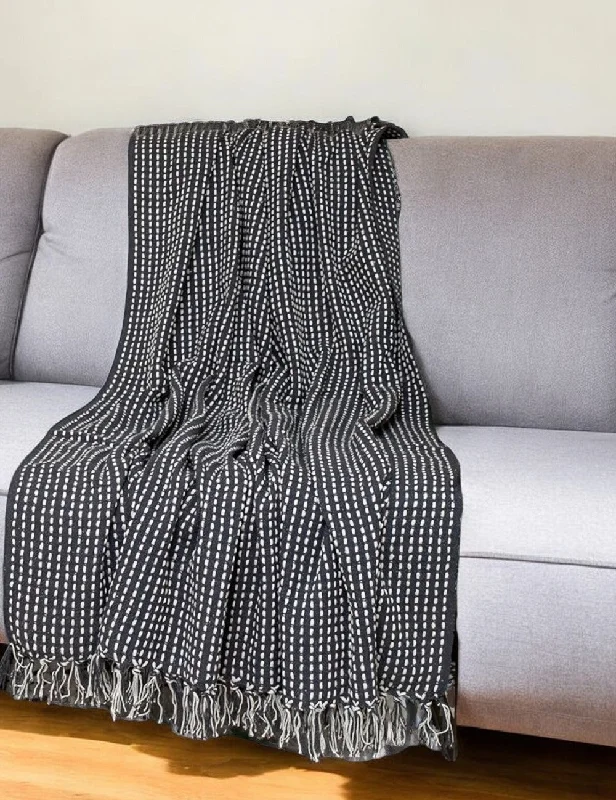 Alpaca wool blankets for a hypoallergenic and warm option67" X 52" Black and White Woven Cotton Striped Throw Blanket with Tassels