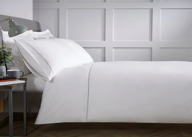 Oversized duvet covers that drape beautifully over the sides of the bed for a luxurious lookChristy "Broadway" Duvet Cover Sets in White with Silver Embroidery