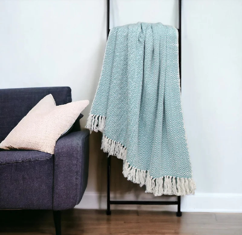 Cotton blankets for breathability and a lightweight feelHandloomed Light Gray Cotton Throw Blanket with Tassels